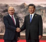 Vladimir_Putin_and_Xi_Jinping_2018-06-10_SCO_summit-769x1024.jpg