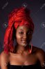 5337765-Beautiful-African-American-woman-wearing-a-traditional-tribal-red-orange-head-scarf-and-.jpg