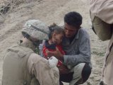 medic aids little Iraqi girl.jpg